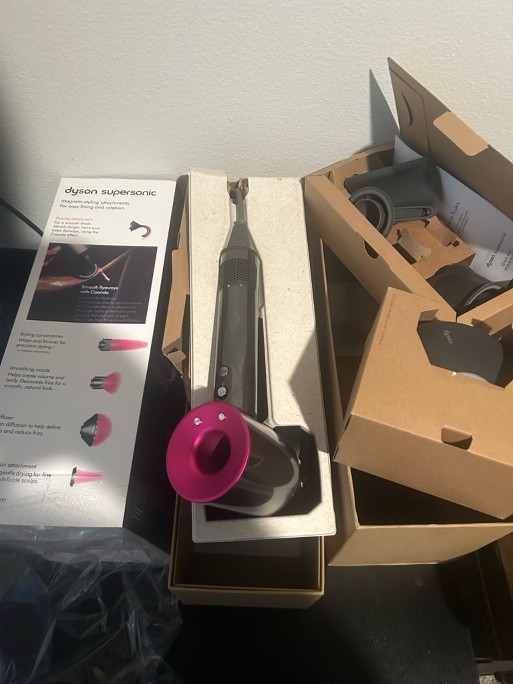 Dyson hair dryer in gray with magenta accent